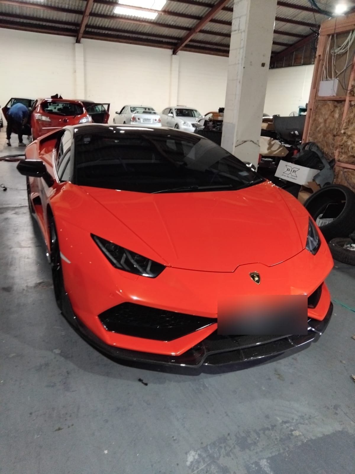 Orange Lamborghini Huracán indoors after a detail